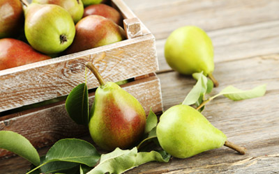 Box of fresh red and green pears
