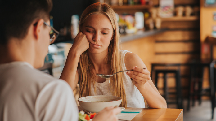 Tired, blonde woman, eating