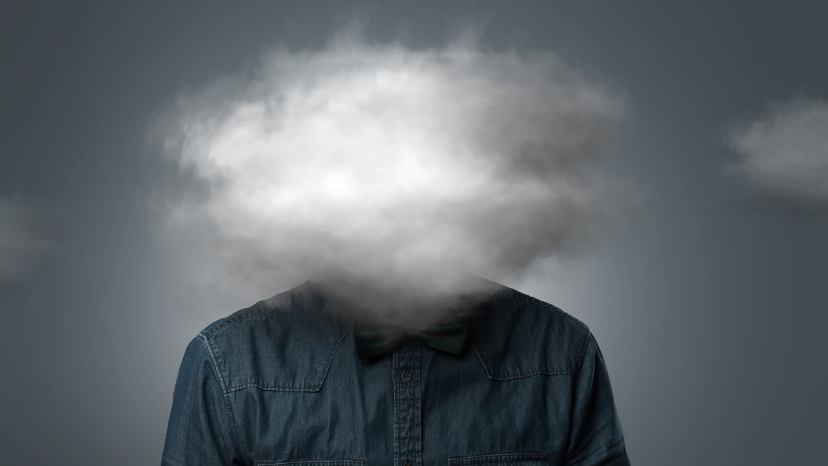 Depressed man with a cloud instead of his head