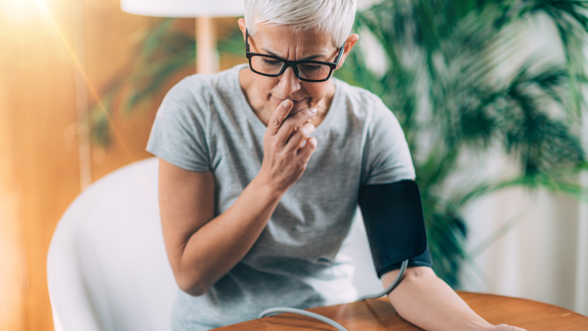 Woman taking her blood pressure