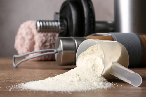 whey protein powder and weights